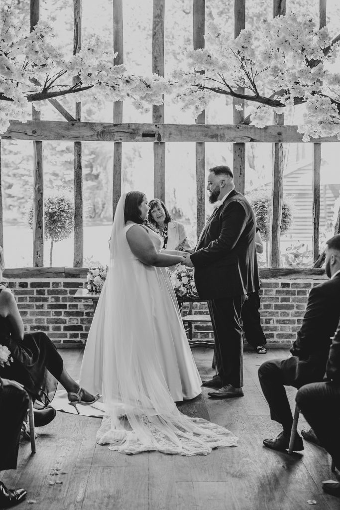 back view of bride and groom taking vows