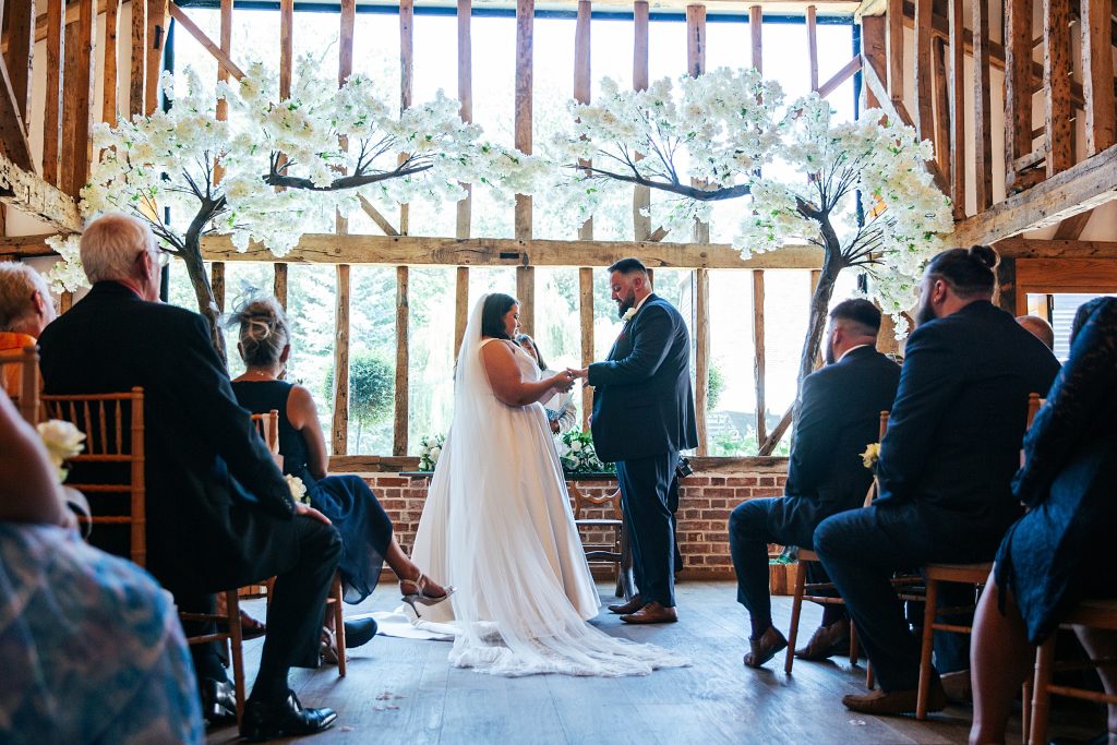bride and groom exchange vows and rings