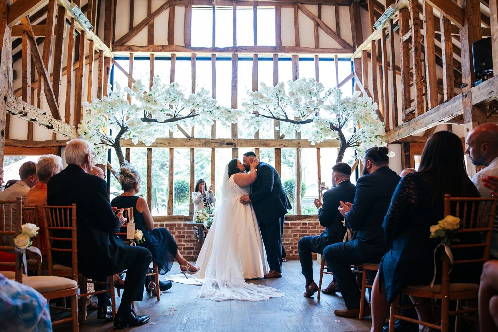 bride and groom kiss after ceremony