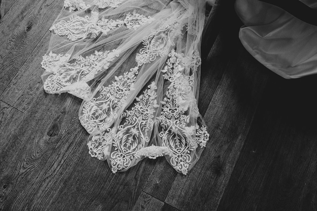 close up of lace detail on brides dress