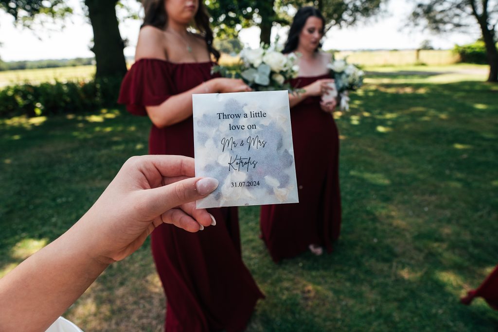 guest holds up bag of confetti