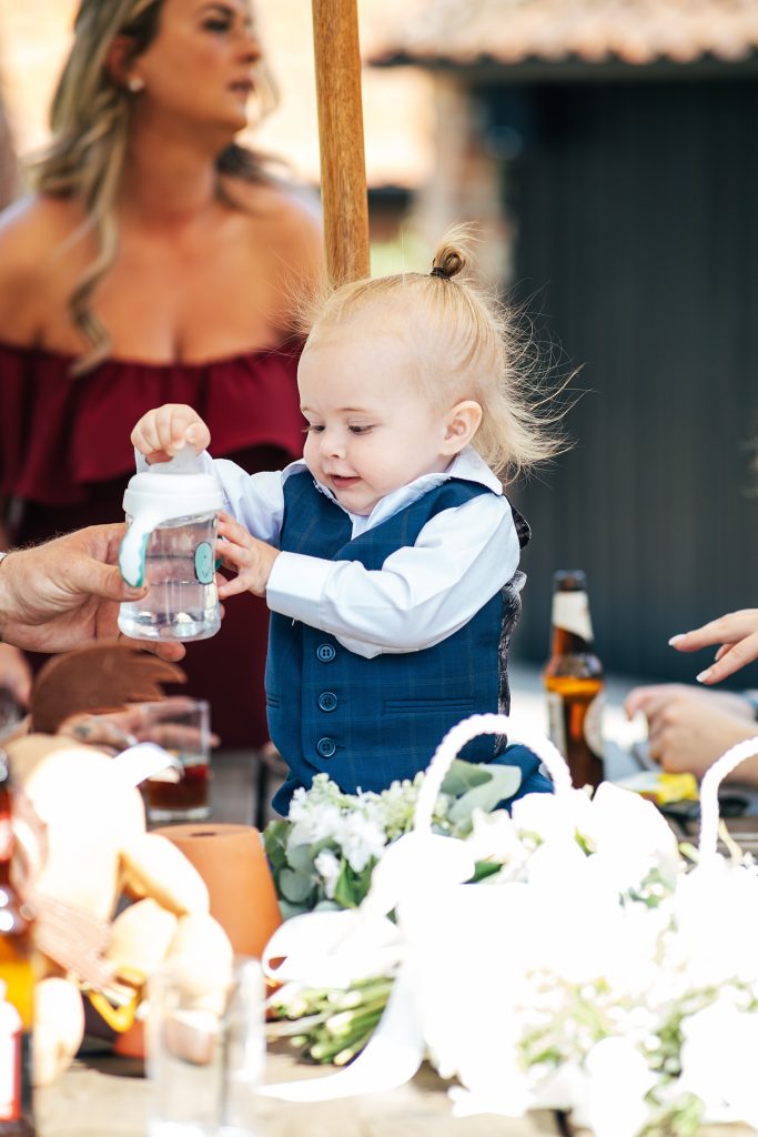baby boy takes bottle of water