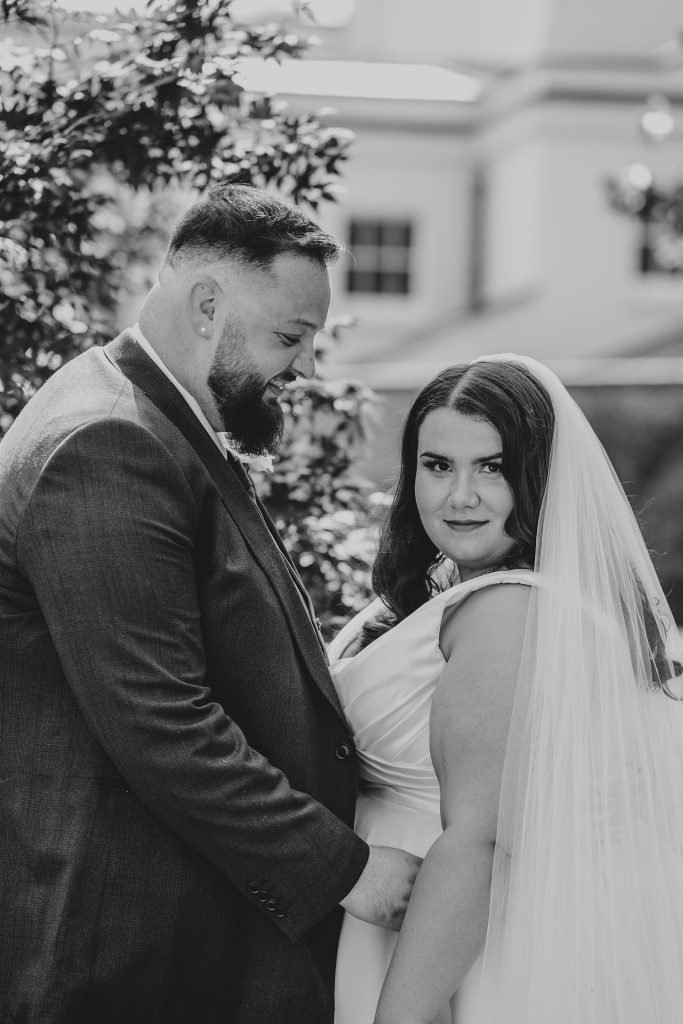 bride and groom in gardens at Blake Hall