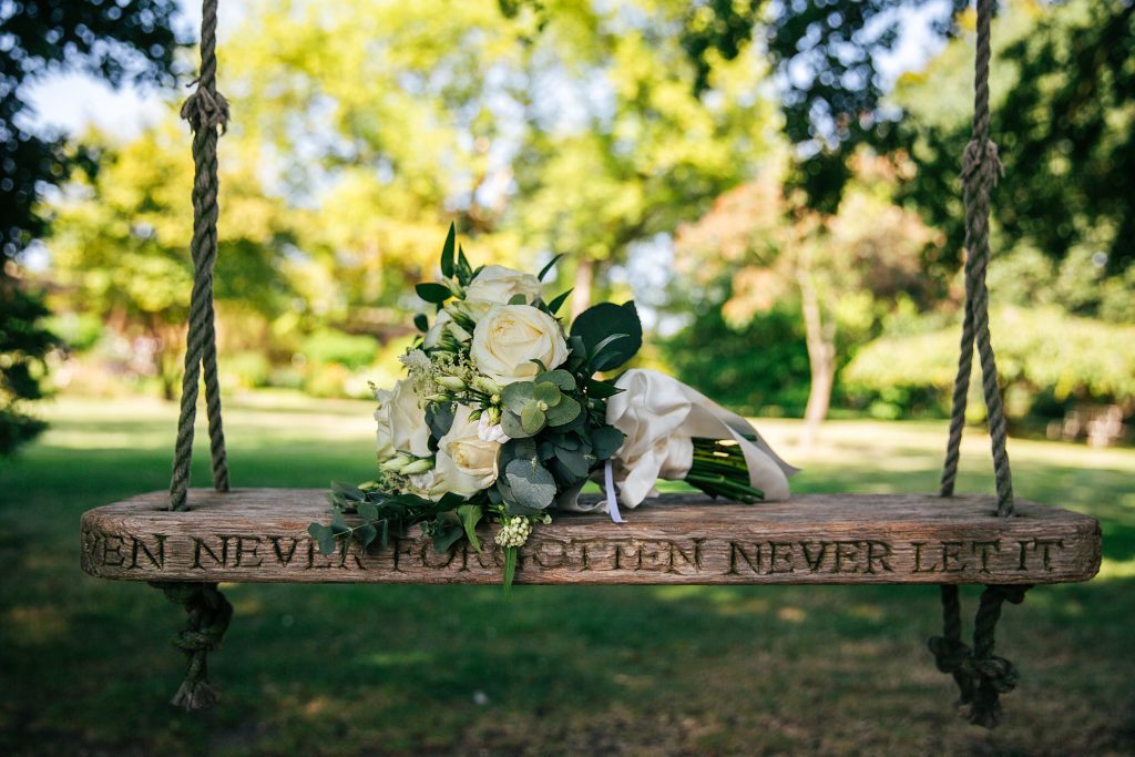 bridal bouquet on swing in garden