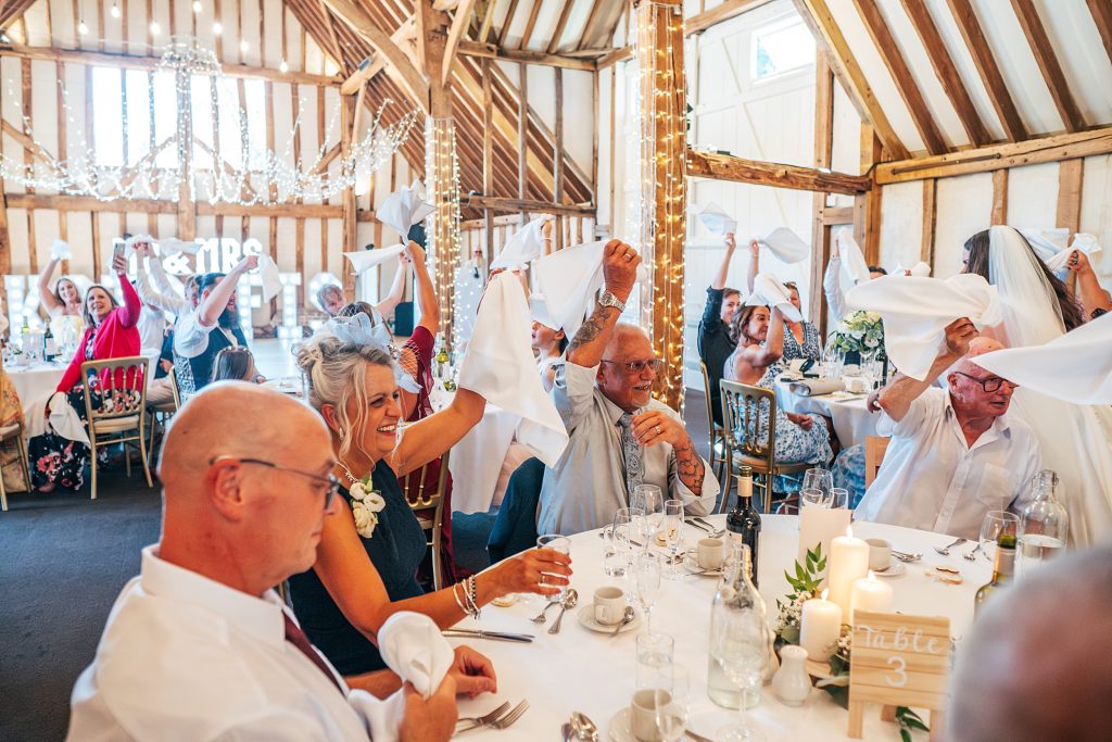 guests waving napkins