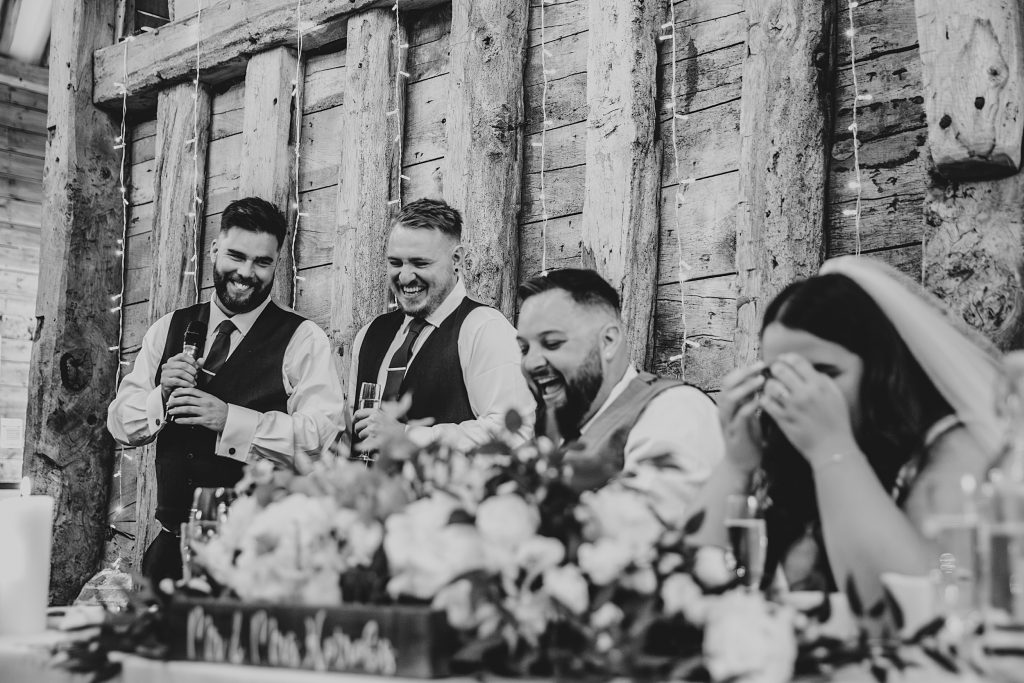 bride and groom laugh at best mens speech