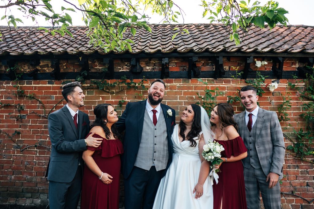 bride groom and friends in garden