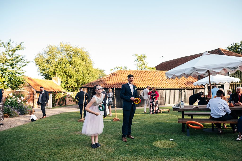 wedding guests play lawn games