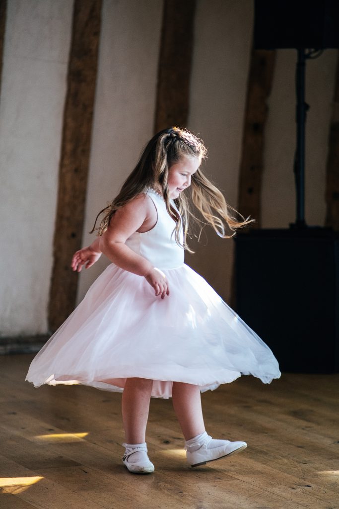 flower girl spins on dance floor