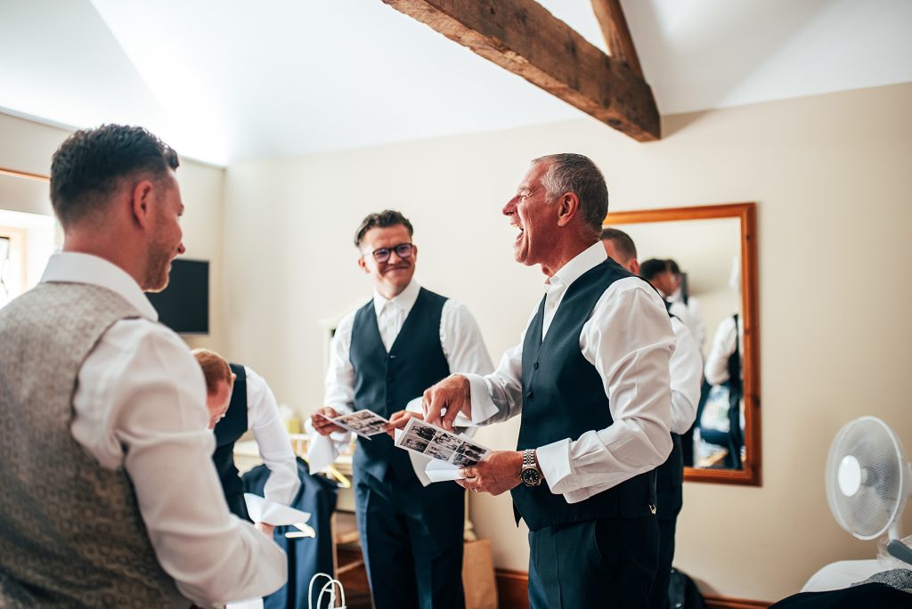 Outdoor Maidens Barn wedding with Singing Waiters Best Essex Wedding Photographer