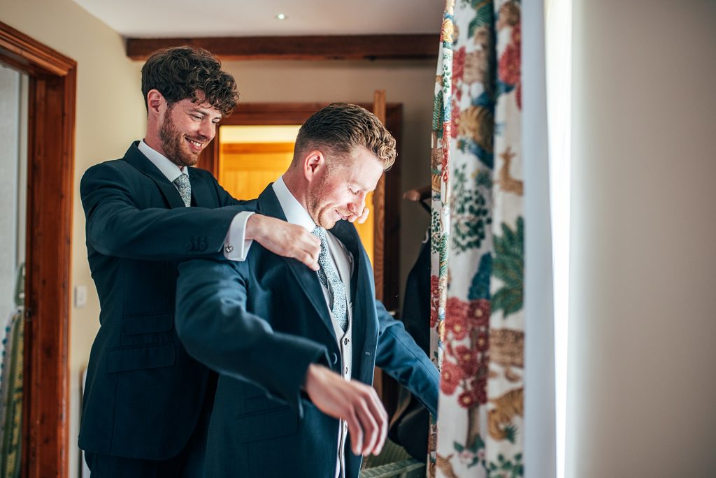 Outdoor Maidens Barn wedding with Singing Waiters Best Essex Wedding Photographer