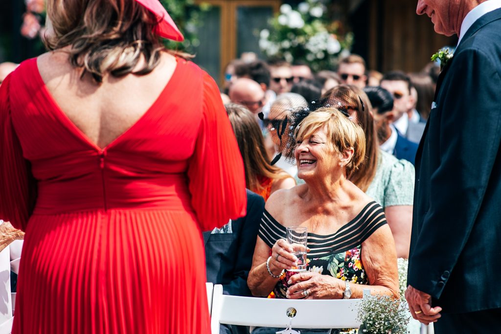 Outdoor Maidens Barn wedding with Singing Waiters Best Essex Wedding Photographer