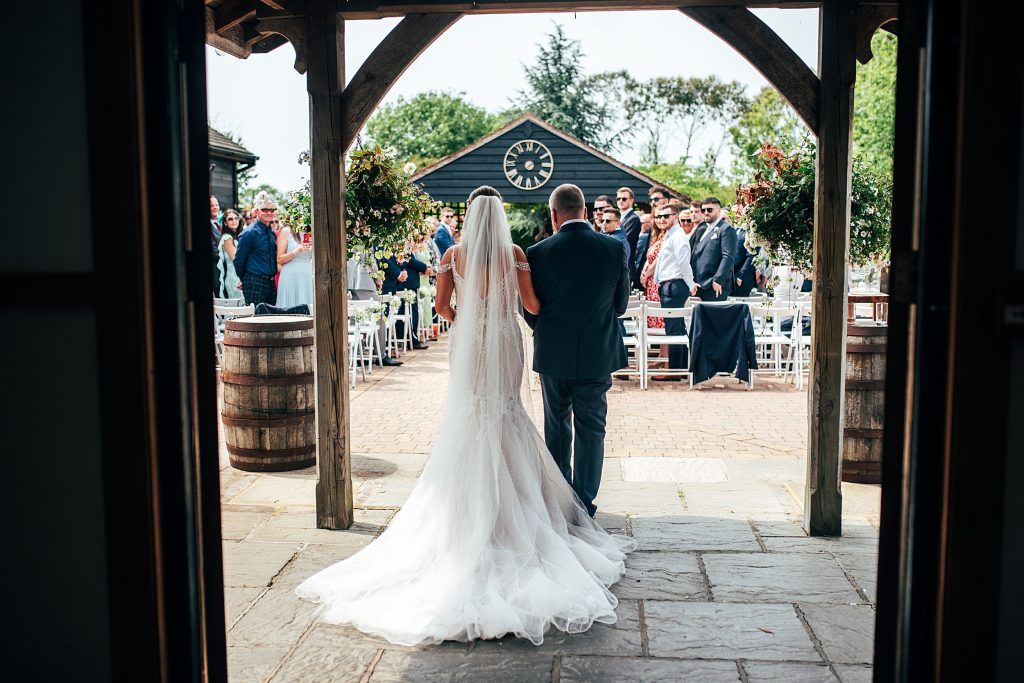 Outdoor Maidens Barn wedding with Singing Waiters Best Essex Wedding Photographer