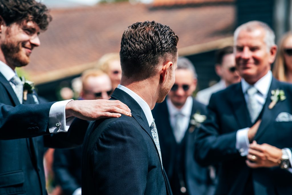 Outdoor Maidens Barn wedding with Singing Waiters Best Essex Wedding Photographer