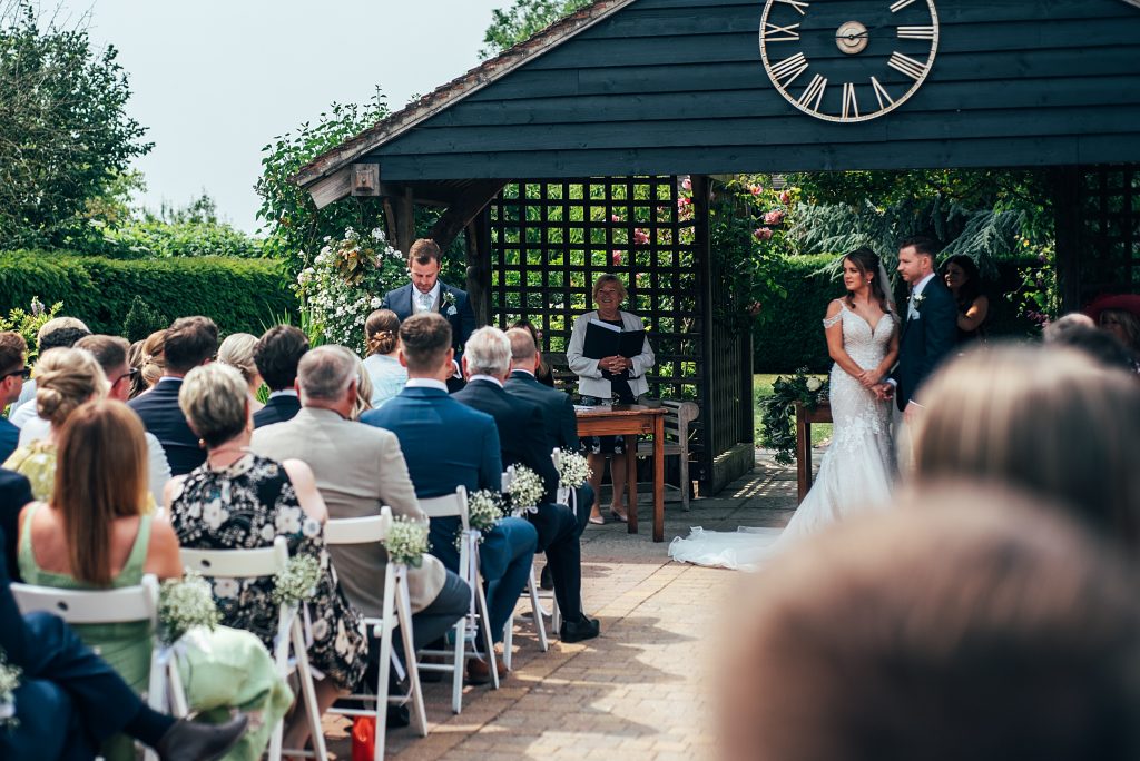 Outdoor Maidens Barn wedding with Singing Waiters Best Essex Wedding Photographer