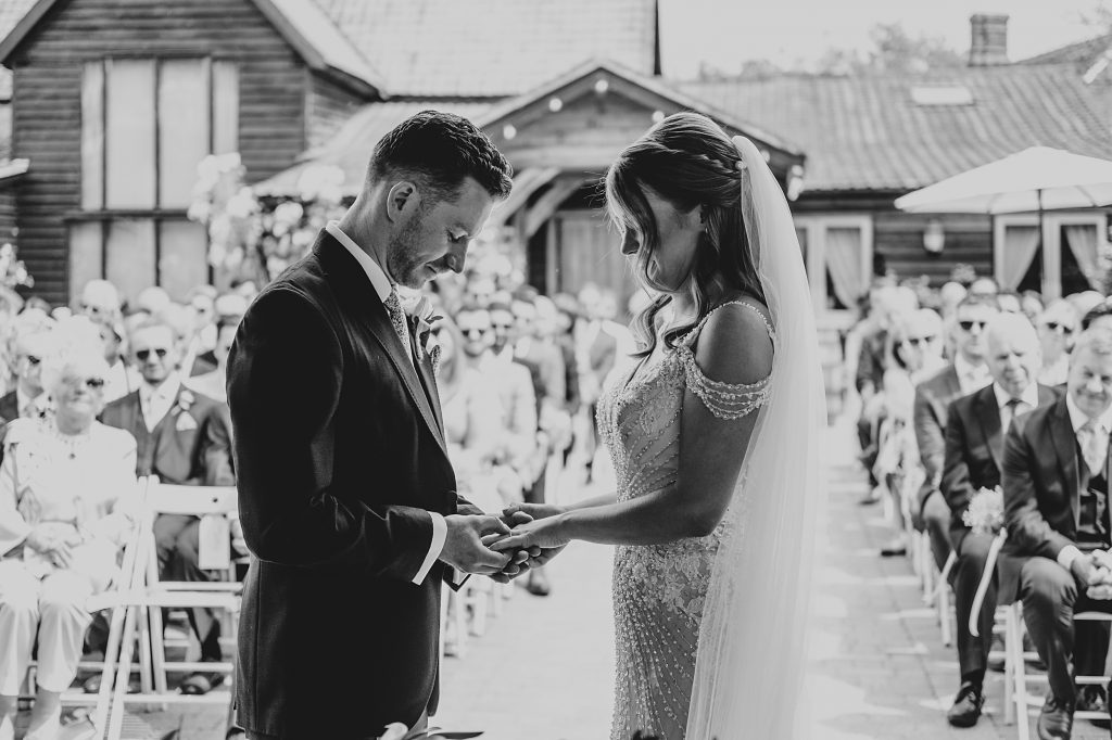 Outdoor Maidens Barn wedding with Singing Waiters Best Essex Wedding Photographer