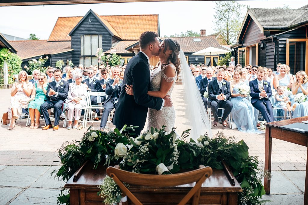 Outdoor Maidens Barn wedding with Singing Waiters Best Essex Wedding Photographer