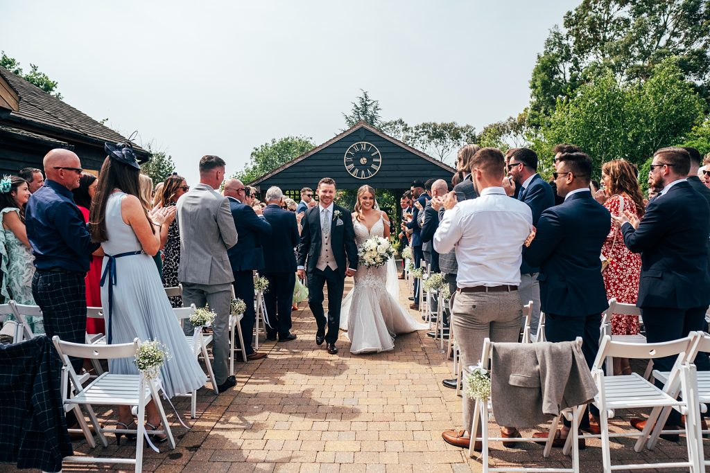 Outdoor Maidens Barn wedding with Singing Waiters Best Essex Wedding Photographer