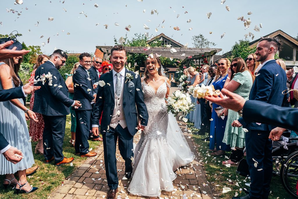 Outdoor Maidens Barn wedding with Singing Waiters Best Essex Wedding Photographer