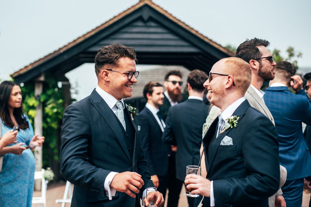 Outdoor Maidens Barn wedding with Singing Waiters Best Essex Wedding Photographer