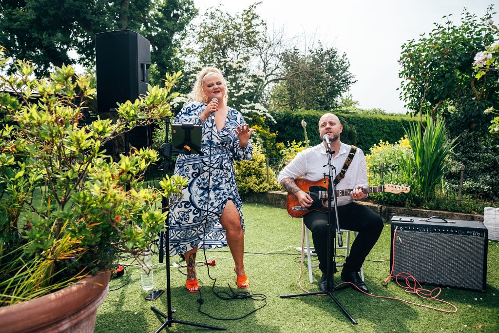 Outdoor Maidens Barn wedding with Singing Waiters Best Essex Wedding Photographer
