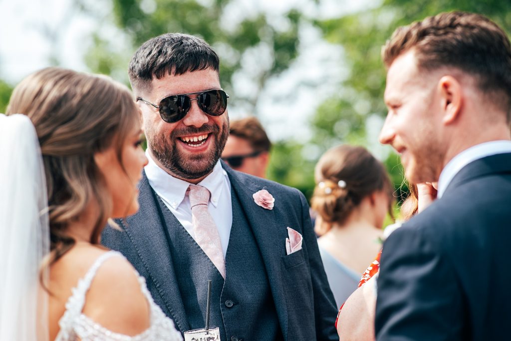 Outdoor Maidens Barn wedding with Singing Waiters Best Essex Wedding Photographer
