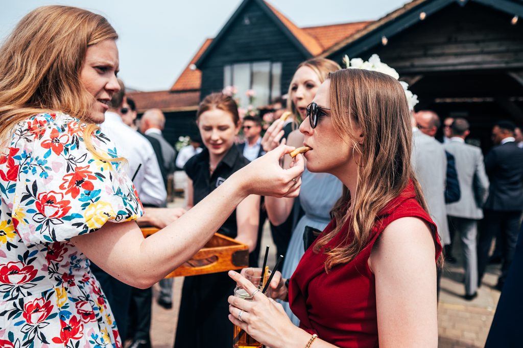 Outdoor Maidens Barn wedding with Singing Waiters Best Essex Wedding Photographer