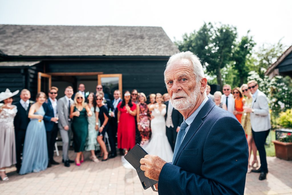 Outdoor Maidens Barn wedding with Singing Waiters Best Essex Wedding Photographer