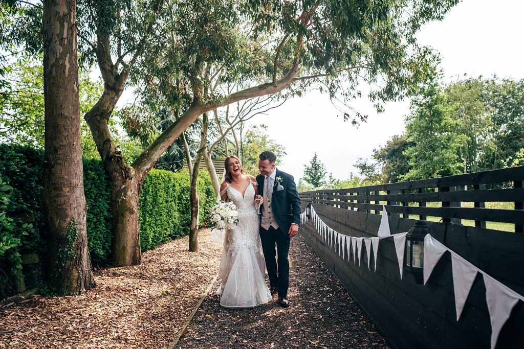 Outdoor Maidens Barn wedding with Singing Waiters Best Essex Wedding Photographer