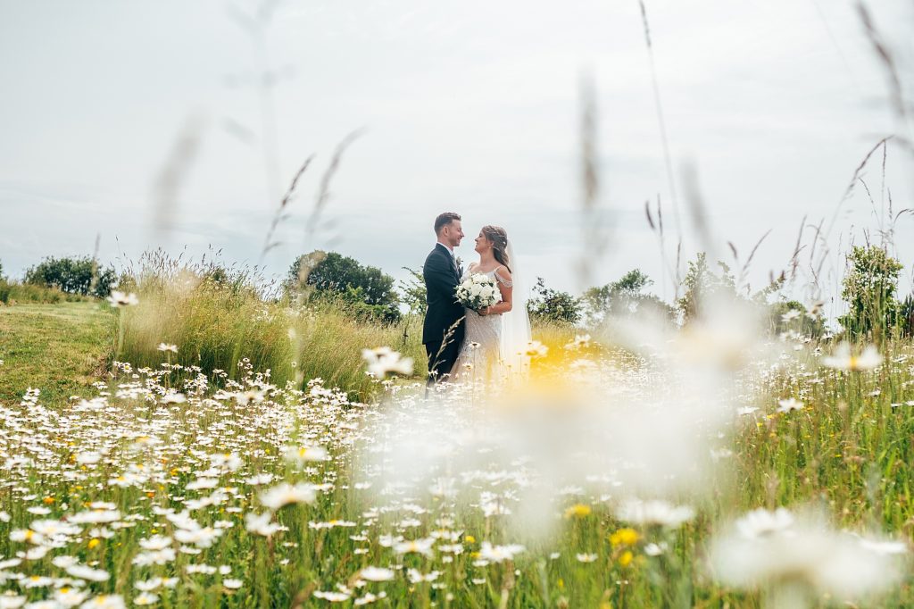 Outdoor Maidens Barn wedding with Singing Waiters Best Essex Wedding Photographer