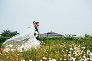 Outdoor Maidens Barn wedding with Singing Waiters Best Essex Wedding Photographer