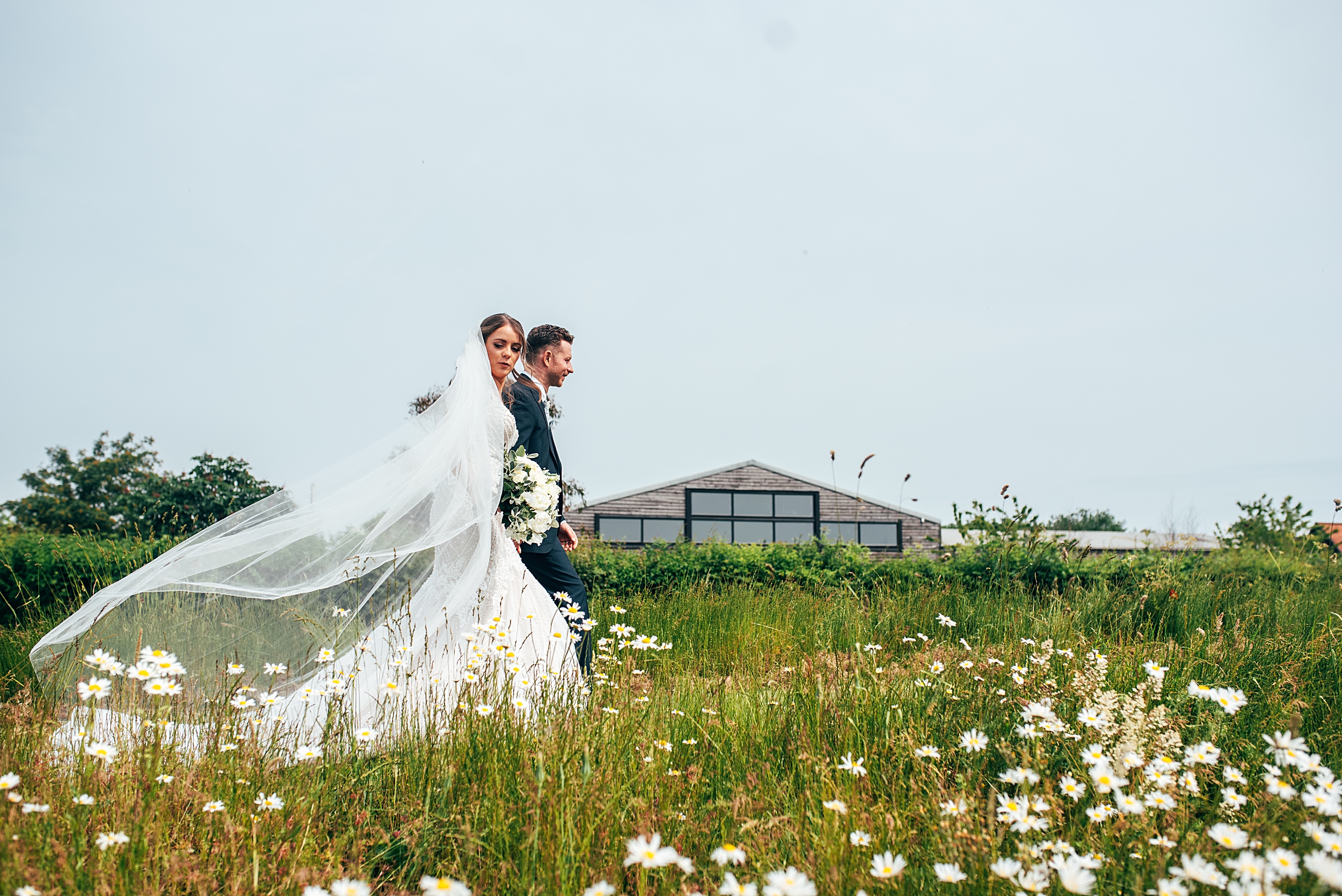 Outdoor Maidens Barn wedding with Singing Waiters Best Essex Wedding Photographer