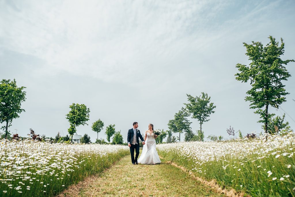 Outdoor Maidens Barn wedding with Singing Waiters Best Essex Wedding Photographer