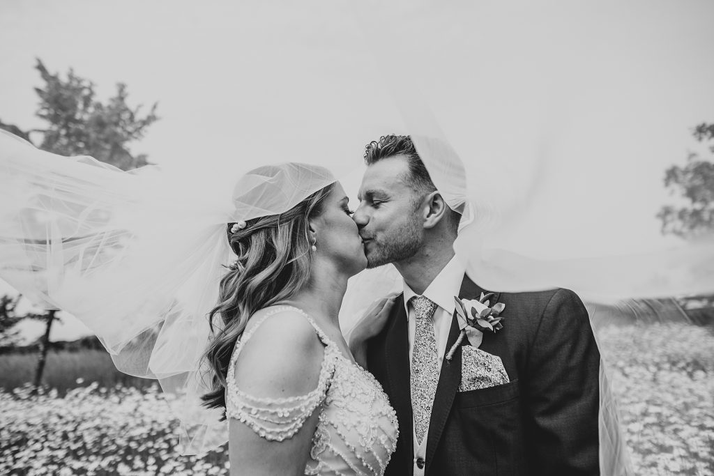 Outdoor Maidens Barn wedding with Singing Waiters Best Essex Wedding Photographer