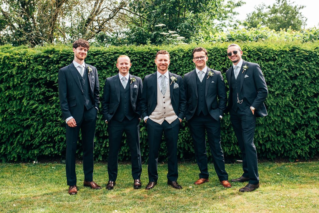 Outdoor Maidens Barn wedding with Singing Waiters Best Essex Wedding Photographer