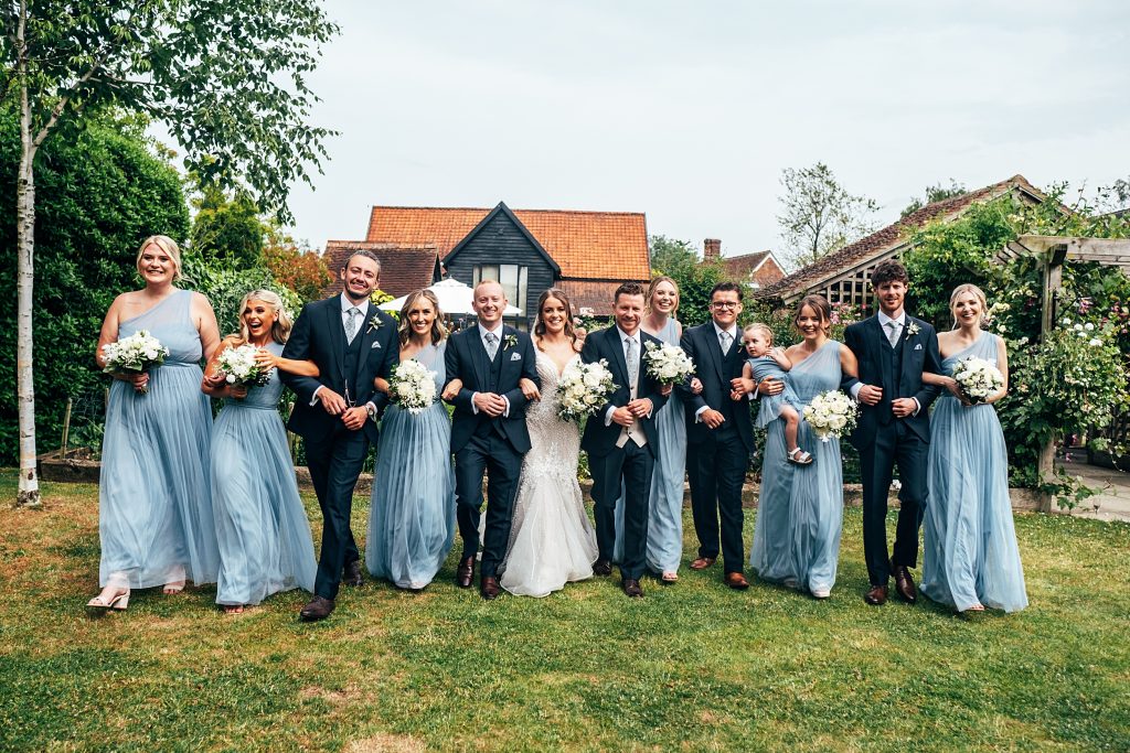 Outdoor Maidens Barn wedding with Singing Waiters Best Essex Wedding Photographer