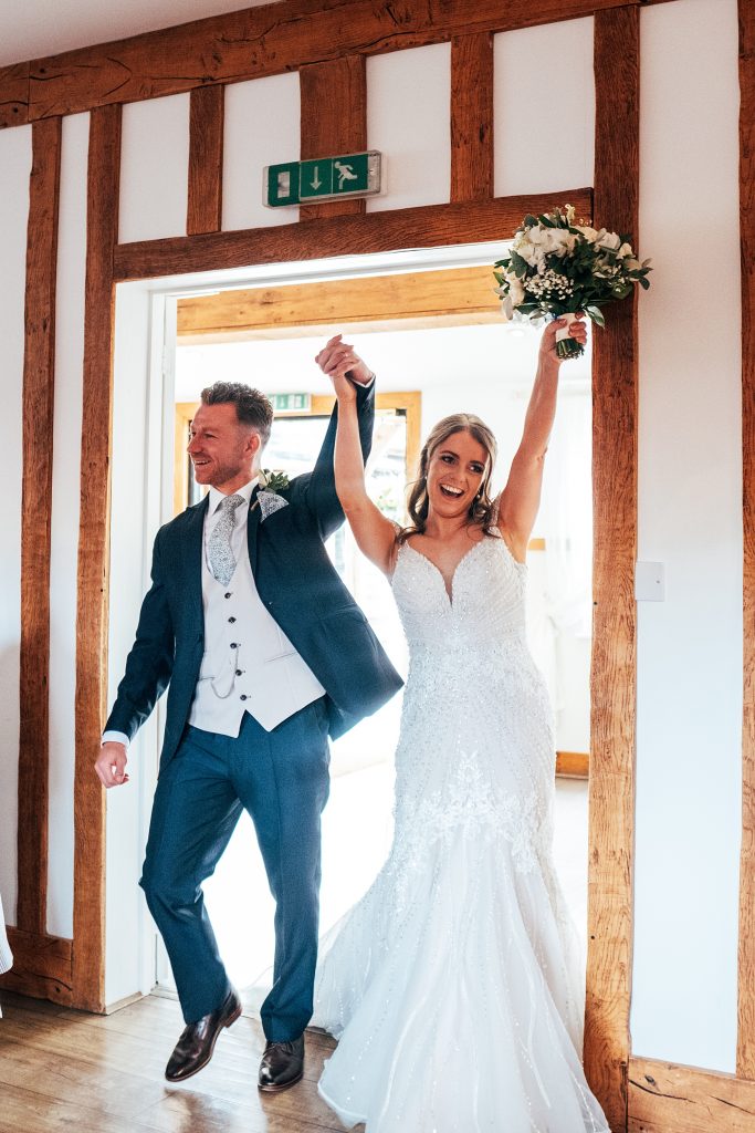Outdoor Maidens Barn wedding with Singing Waiters Best Essex Wedding Photographer