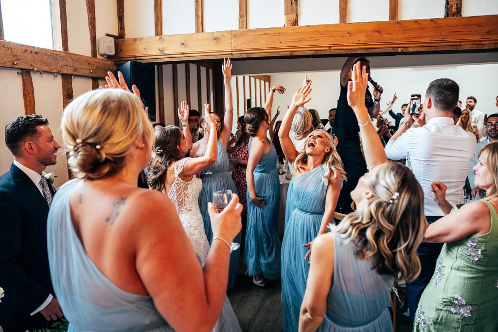 Outdoor Maidens Barn wedding with Singing Waiters Best Essex Wedding Photographer