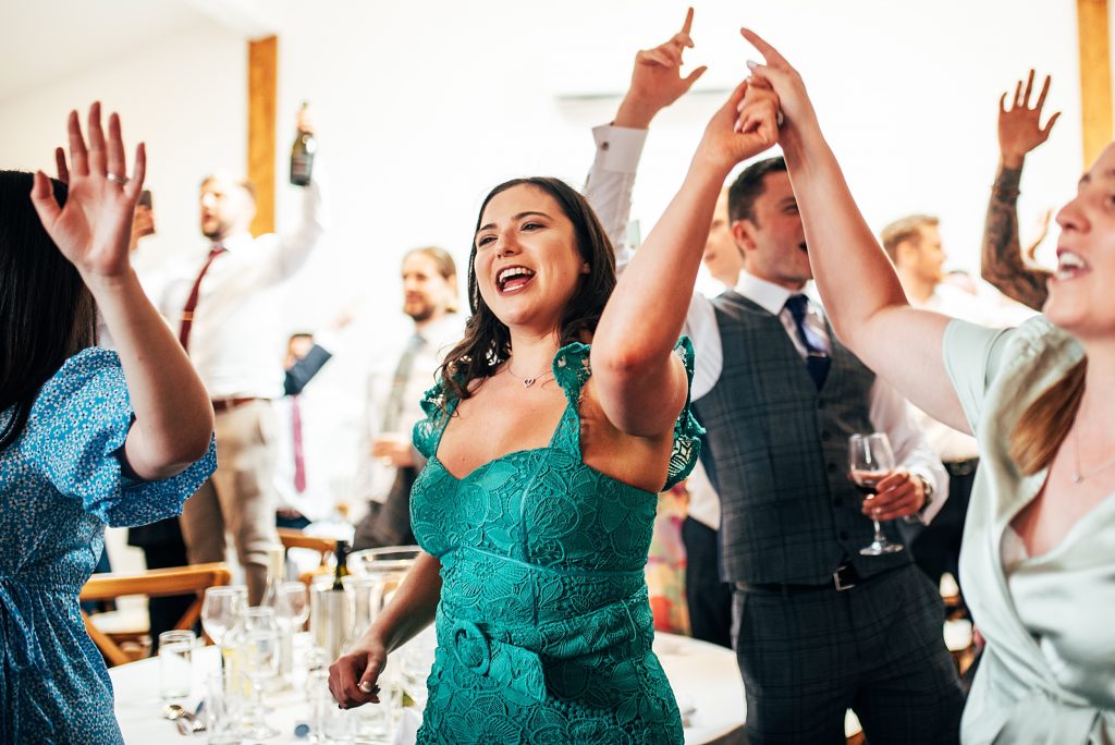 Outdoor Maidens Barn wedding with Singing Waiters Best Essex Wedding Photographer