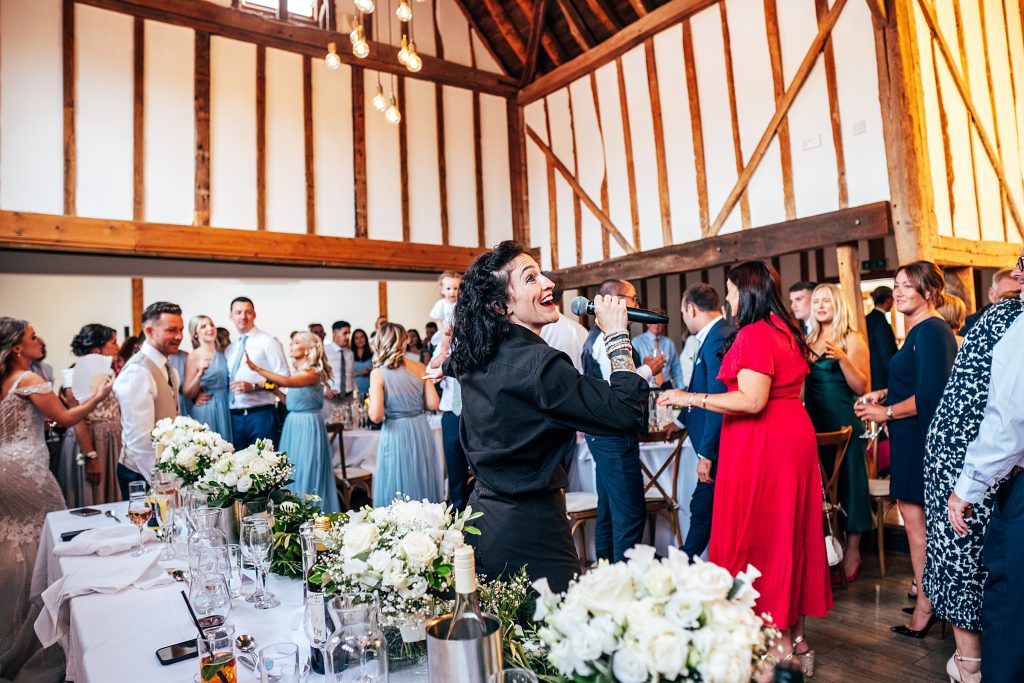 Outdoor Maidens Barn wedding with Singing Waiters Best Essex Wedding Photographer