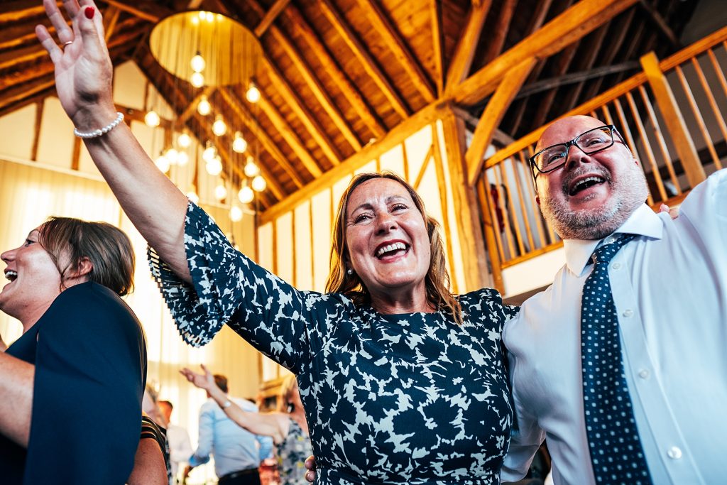 Outdoor Maidens Barn wedding with Singing Waiters Best Essex Wedding Photographer