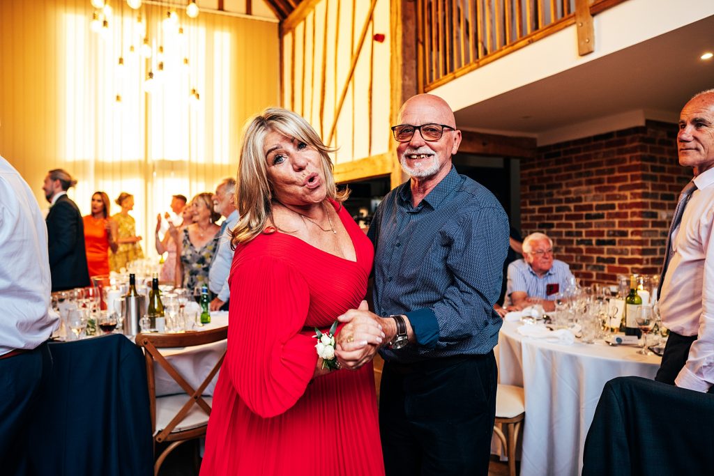 Outdoor Maidens Barn wedding with Singing Waiters Best Essex Wedding Photographer