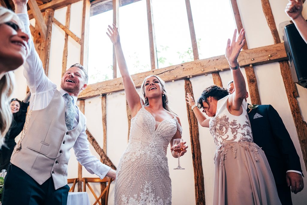 Outdoor Maidens Barn wedding with Singing Waiters Best Essex Wedding Photographer