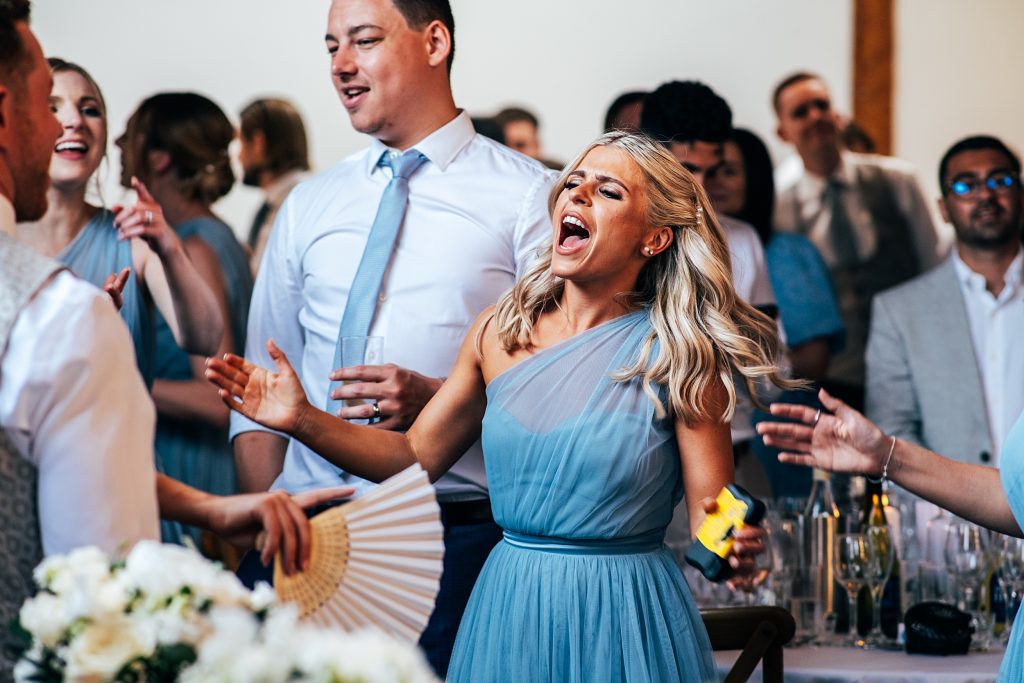 Outdoor Maidens Barn wedding with Singing Waiters Best Essex Wedding Photographer