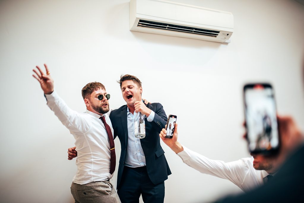 Outdoor Maidens Barn wedding with Singing Waiters Best Essex Wedding Photographer