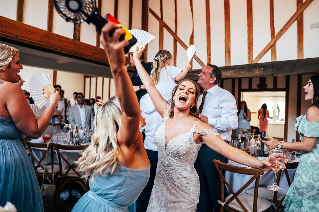 Outdoor Maidens Barn wedding with Singing Waiters Best Essex Wedding Photographer