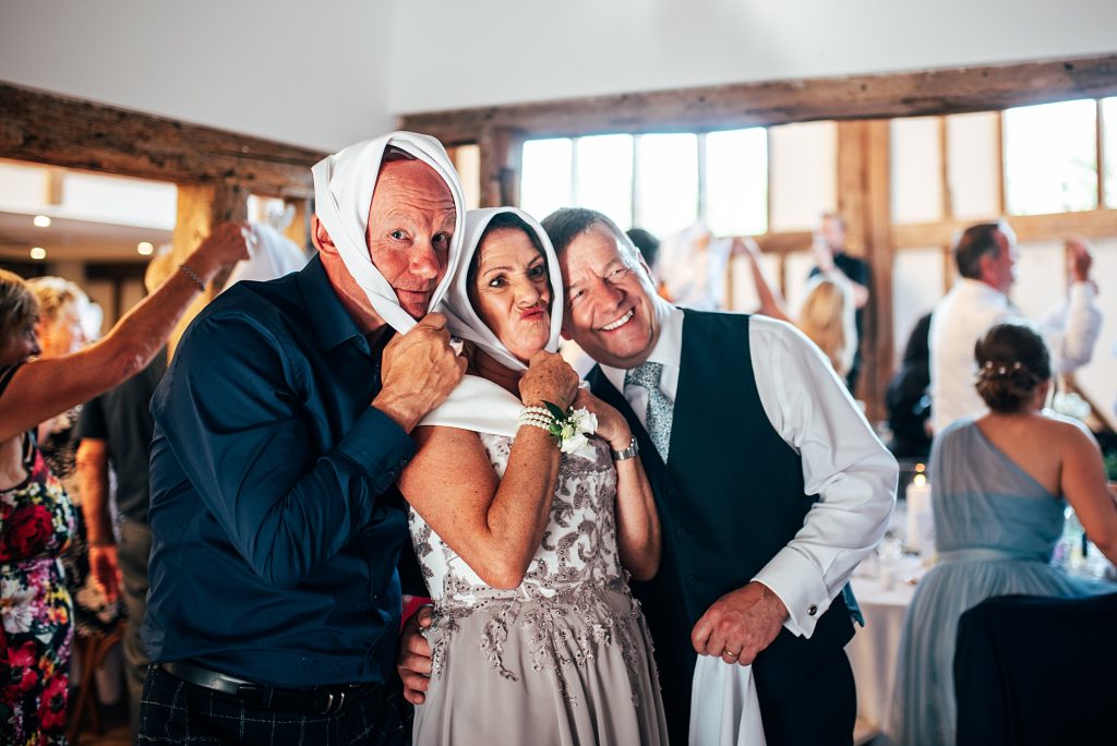 Outdoor Maidens Barn wedding with Singing Waiters Best Essex Wedding Photographer