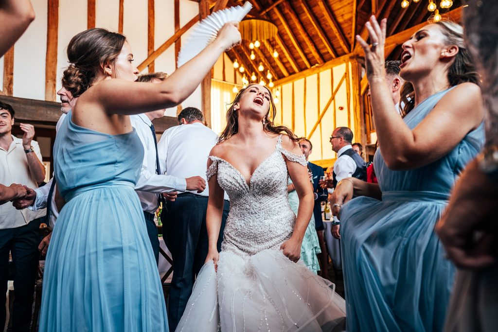 Outdoor Maidens Barn wedding with Singing Waiters Best Essex Wedding Photographer