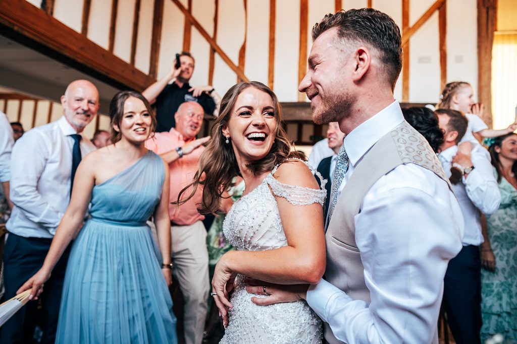 Outdoor Maidens Barn wedding with Singing Waiters Best Essex Wedding Photographer