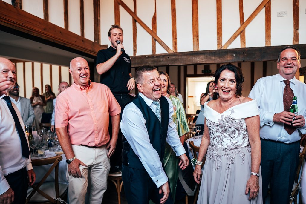Outdoor Maidens Barn wedding with Singing Waiters Best Essex Wedding Photographer